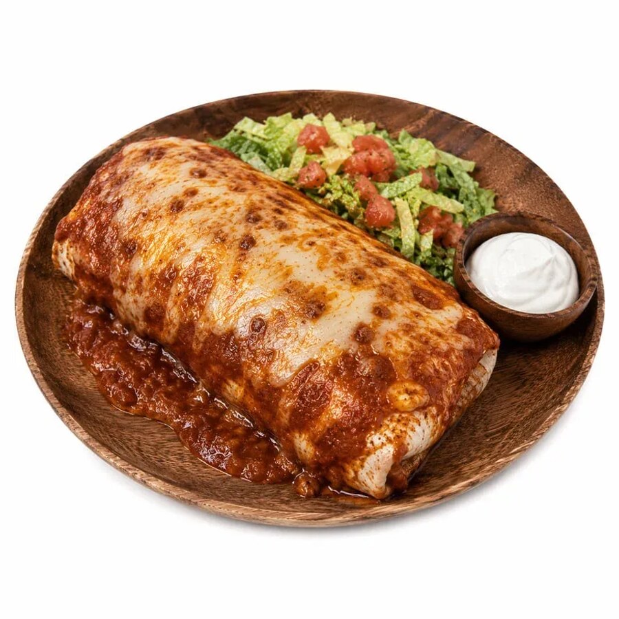 An extra large wet burrito smothered in enchilada sauce and cheese with guacamole and sour cream